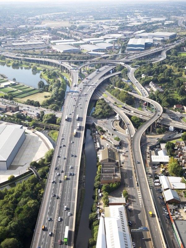 Aerial view of a highway interchange with vehicles in traffic